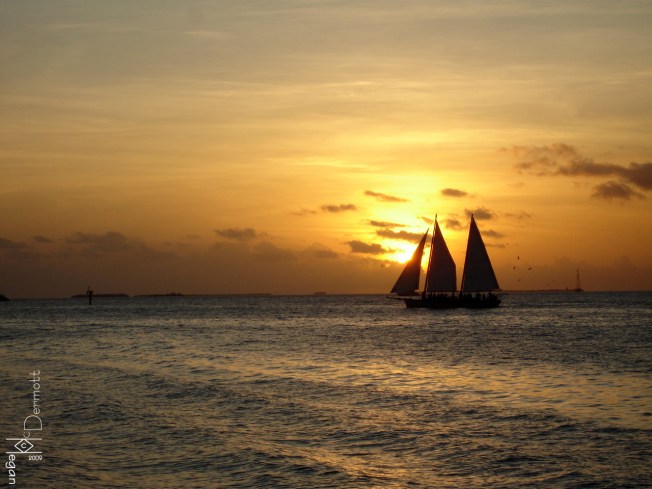 Orange sunset sailboat mcm